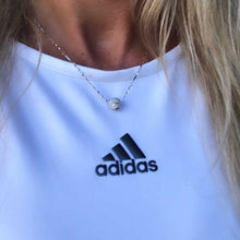 Load image into Gallery viewer, Wearing the Silver Tennis Ball Pendant Necklace