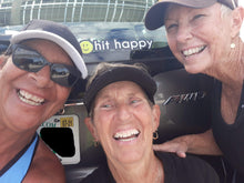 Load image into Gallery viewer, Three women with their Black Hit Happy Tennis Car Magnet on a car
