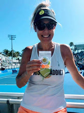 Load image into Gallery viewer, A woman wearing the Hit Happy Mesh Tennis Visor on the tennis court