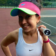 Load image into Gallery viewer, A woman with our Tennis Butt Decal - "Boxers or Briefs" on her tennis racquet