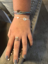 Load image into Gallery viewer, Woman wearing the Luxe Tennis Racket and Pearl bracelet and tennis ring