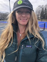 Load image into Gallery viewer, Woman wearing the Pickleball Paddle Pendant Necklace on the tennis court