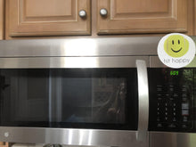 Load image into Gallery viewer, Hit Happy Tennis Magnet on a microwave