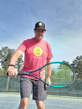 Load image into Gallery viewer, A man wearing the Hit Happy Tennis- Men&#39;s Next Level Triblend T-Shirt on the tennis court
