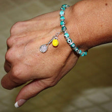 Load image into Gallery viewer, Woman wearing the Tennis Karma Bracelet