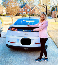 Load image into Gallery viewer, A woman showing off her Black Hit Happy Tennis Car Magnet on her car