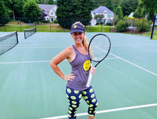 Load image into Gallery viewer, A woman wearing the Hit Happy Mesh Tennis Visor on the tennis court
