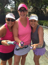 Load image into Gallery viewer, Three women holding tennis racquets with our funny Tennis Butt Decals on the tennis court
