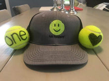Load image into Gallery viewer, Black Hit Happy Tennis Baseball Style Hat with two tennis balls
