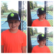 Load image into Gallery viewer, Young boy wearing the Black and White Hit Happy Tennis Baseball Style Hat
