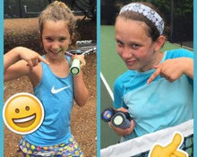 Load image into Gallery viewer, A young girl with our funny Tennis Butt Decals - &quot;Kitties or Puppies&quot; on the end of her tennis racquets

